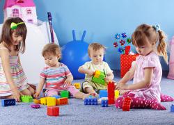 Children playing with toy building blocks
