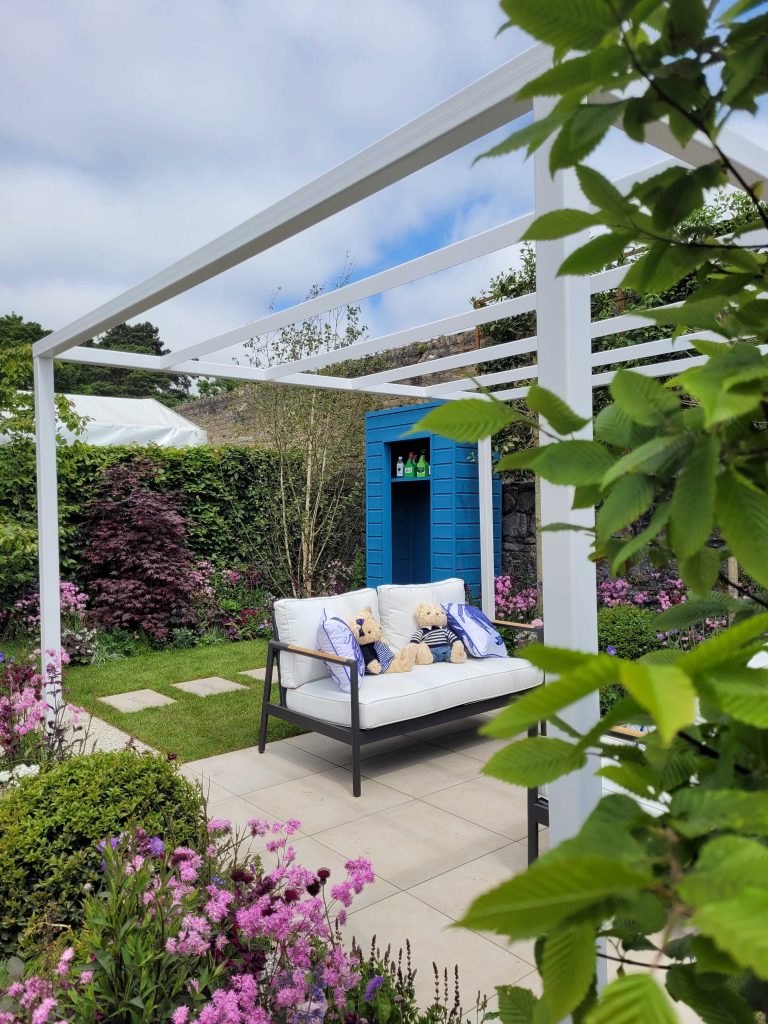 Picture of a garden with a shed and seating area